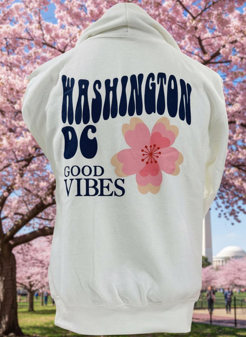 White hoodie with 'Washington DC Good Vibes' text and a pink flower graphic on a white background