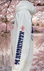 side view of whitehoodie with floral designs and text on a white background