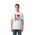 White t-shirt with 'I ❤️ DC' design on a black table.