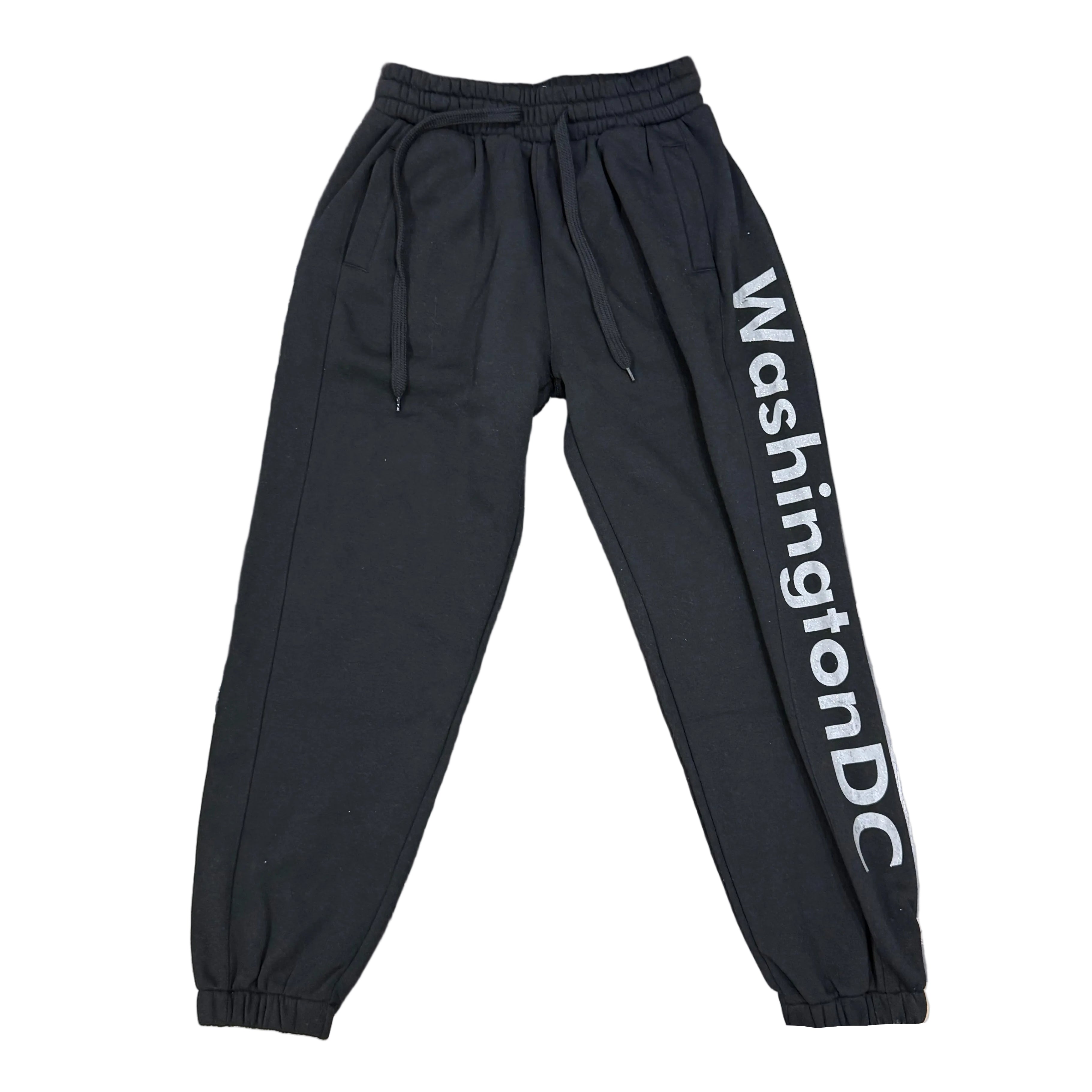 Black pants with 'WashingtonDC' text on a table in an office setting