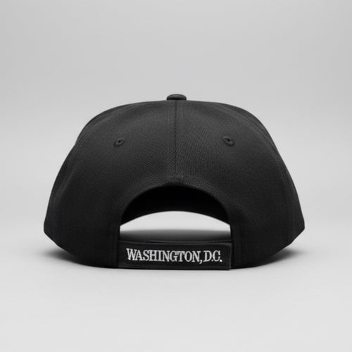 Black cap with 'Washington DC' logo on a reflective surface
