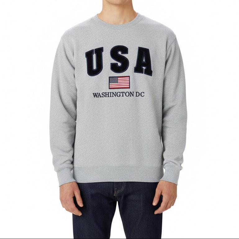 Gray sweatshirt with 'USA Washington D.C.' text on a wooden background